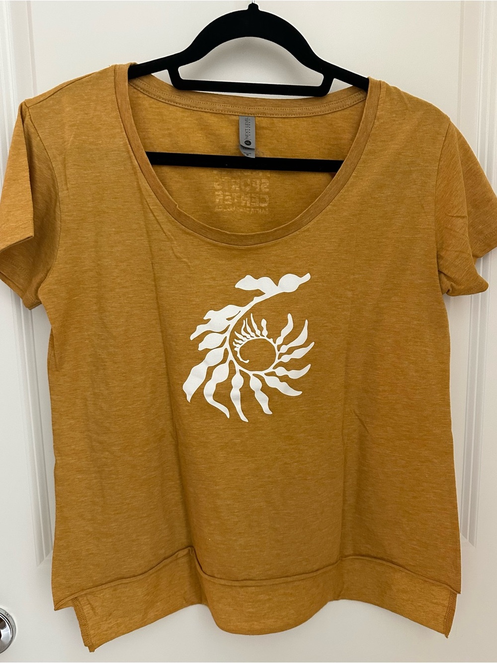 Next Level Apparel Mustard Short Sleeve Tee with White Sunburst Graphic